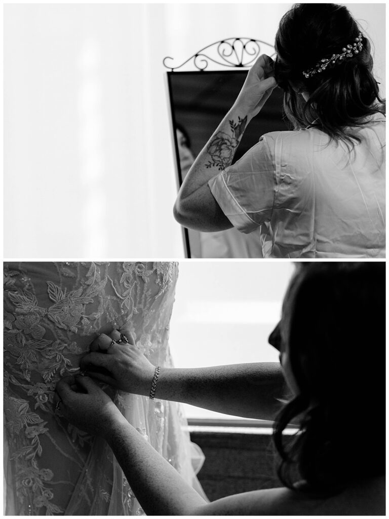 bride puts on gown and fixes hair by The Hazel Club