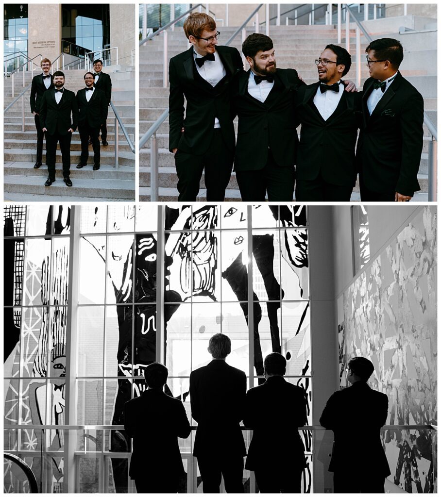 groomsmen stand together with groom on steps and in front of art by The Hazel Club