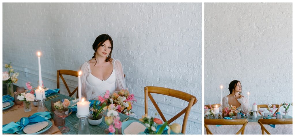 bride sits at table in front of white wall at Junction West styled shoot
