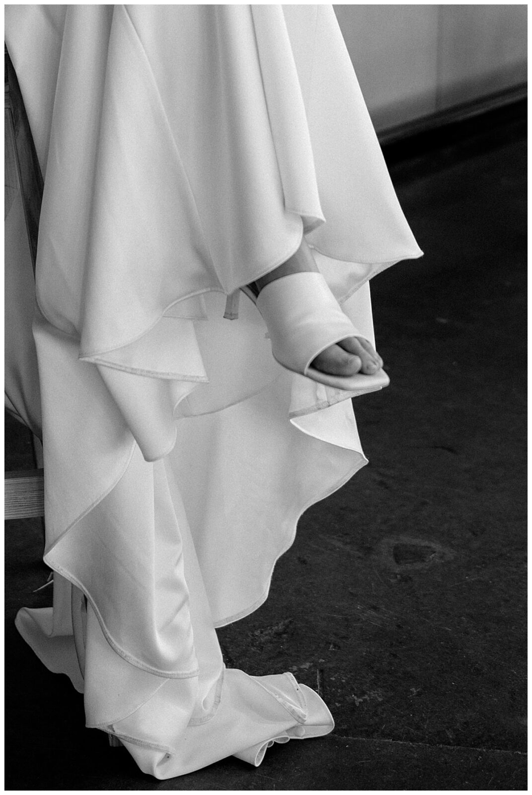 bride's shoe peeks out from under gown at Junction West styled shoot