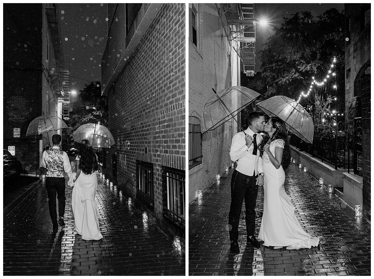 husband and wife kiss under clear umbrellas in the rain by destination wedding photographer