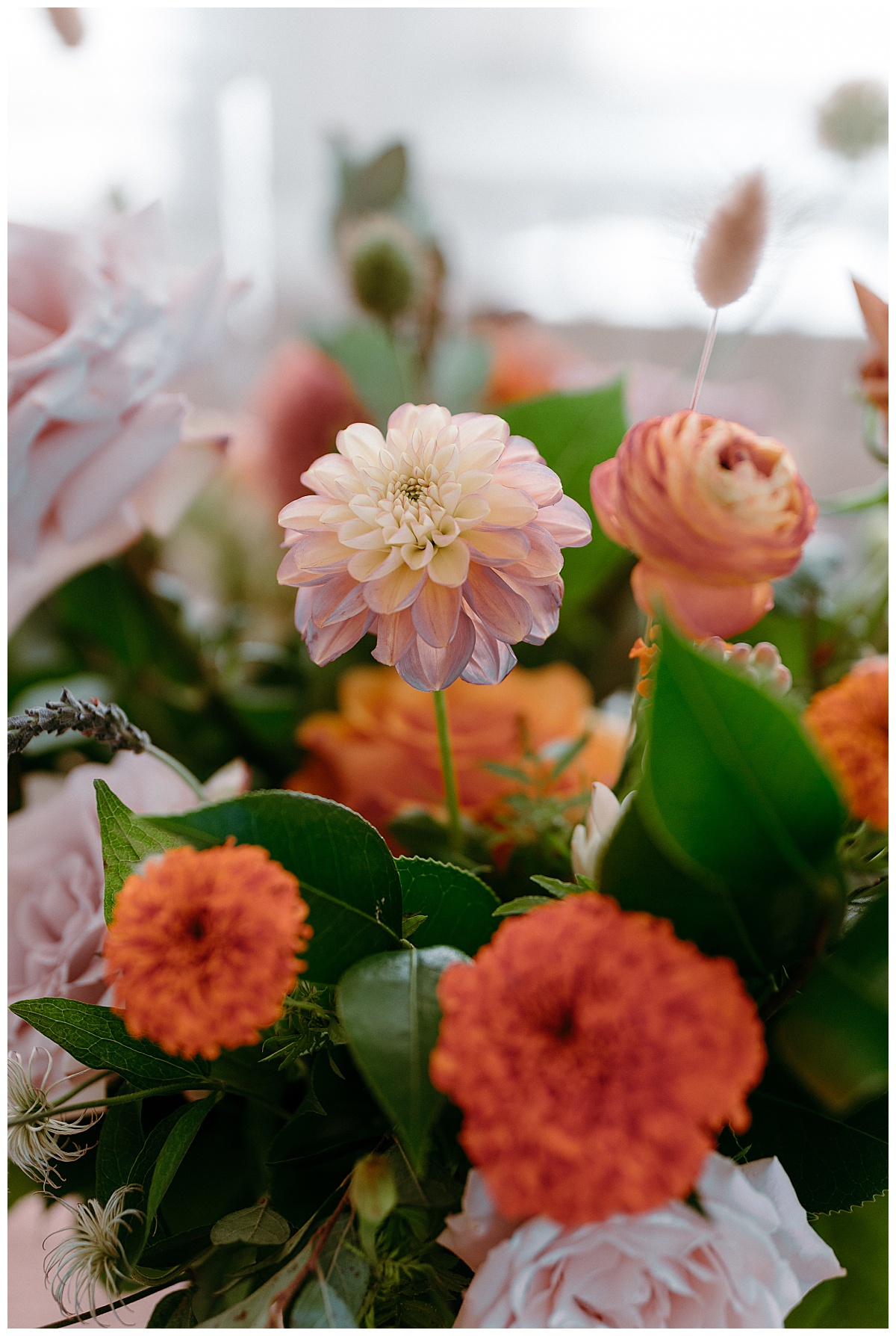 gorgeous seasonal blooms of orange, green, and ivory by North Carolina wedding photographer