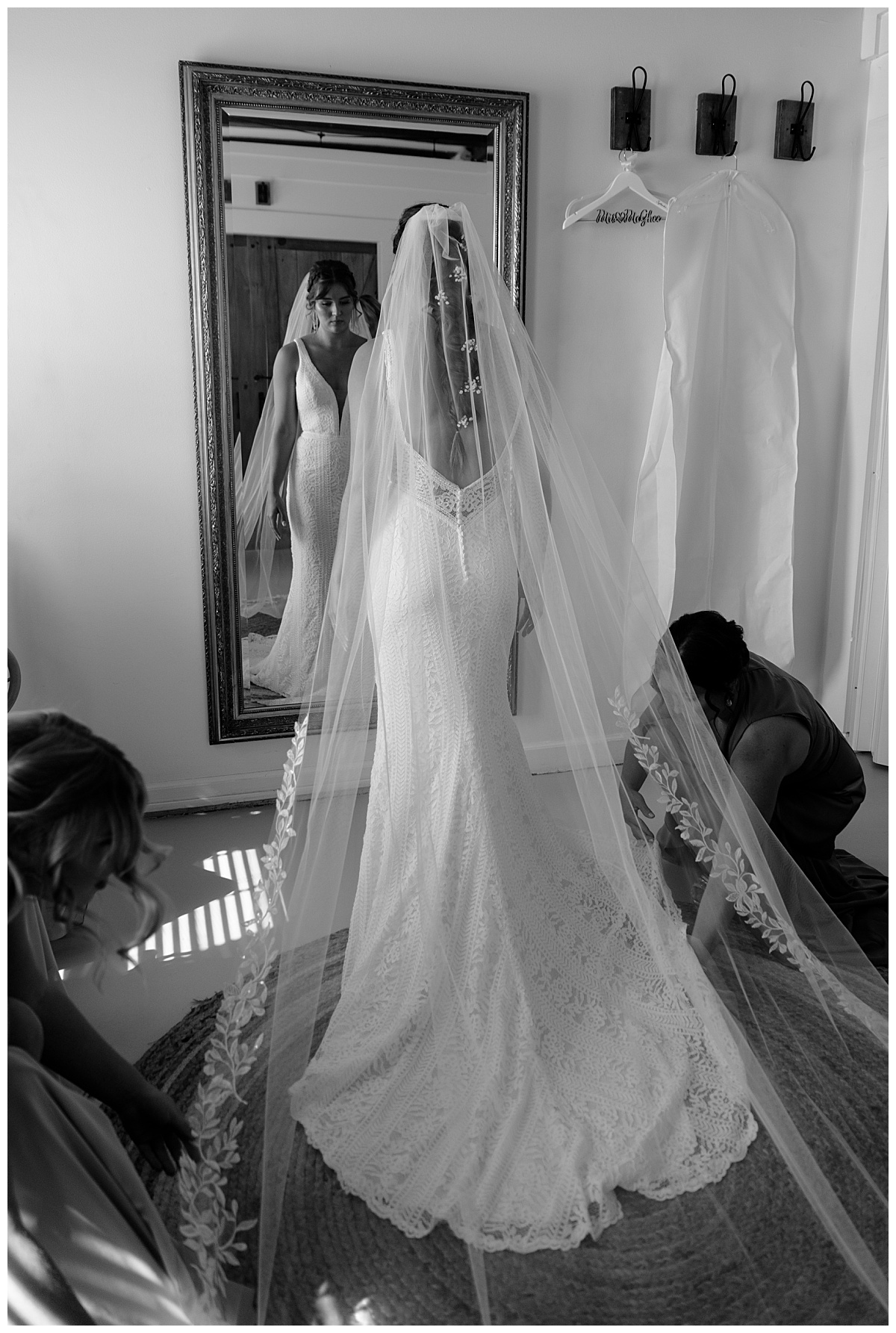 bride stands in front of mirror before River Room nuptials 