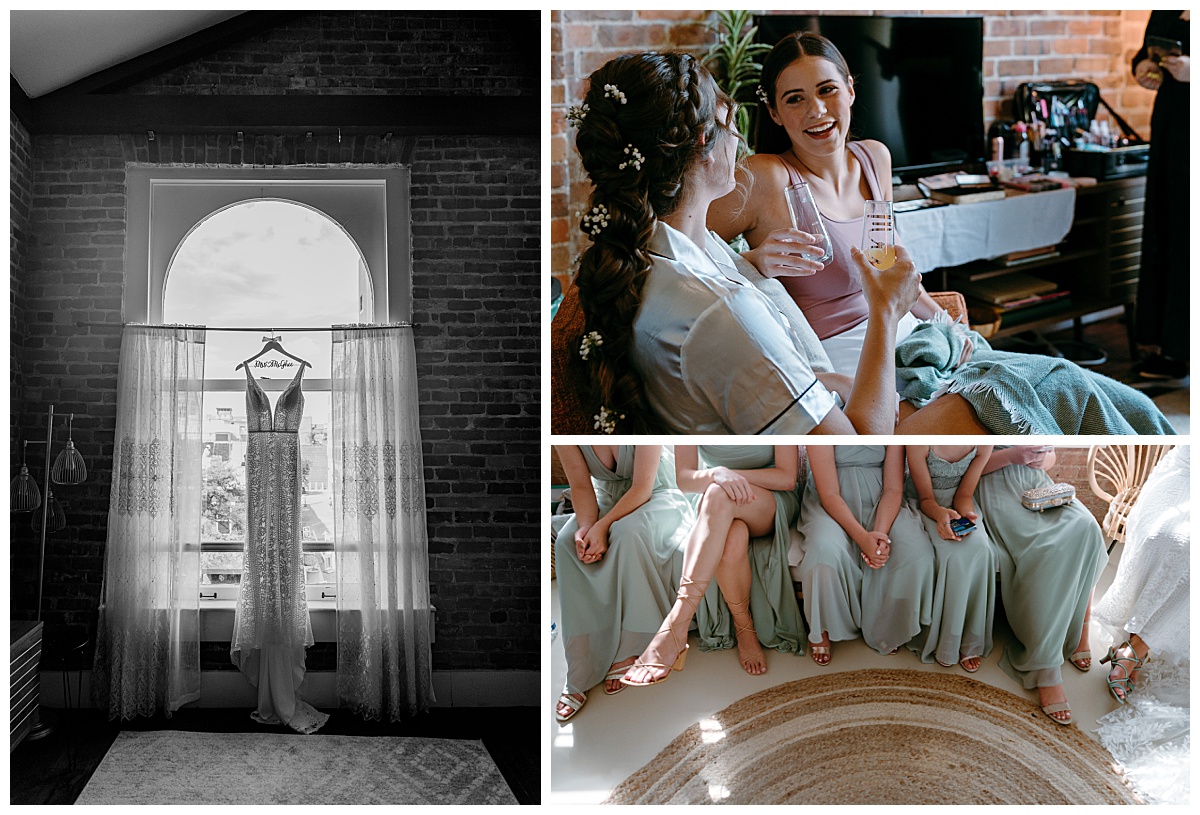 bridesmaids sit together while bridal gown hangs in window by The Hazel Club